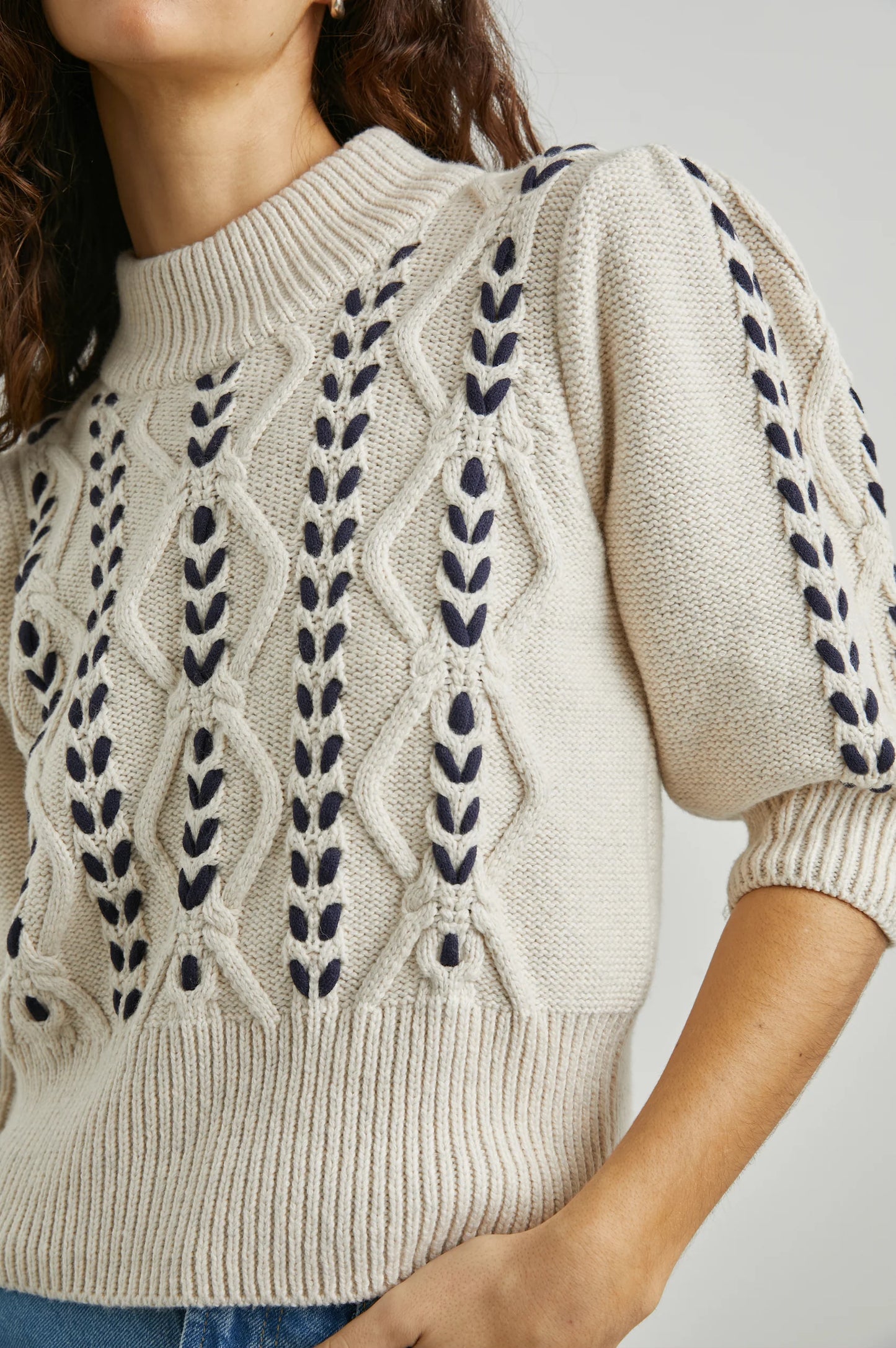 The Addy Cable Knit Sweater by Rails in the color Oatmeal Navy features elbow length sleeves with ribbed details