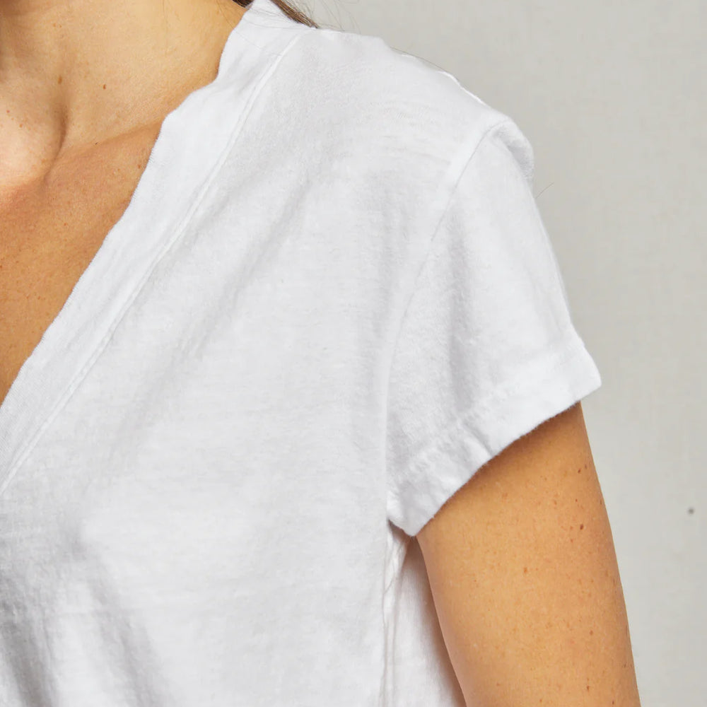 
                      
                        Design detail on the White Alanis V-Neck Tee
                      
                    