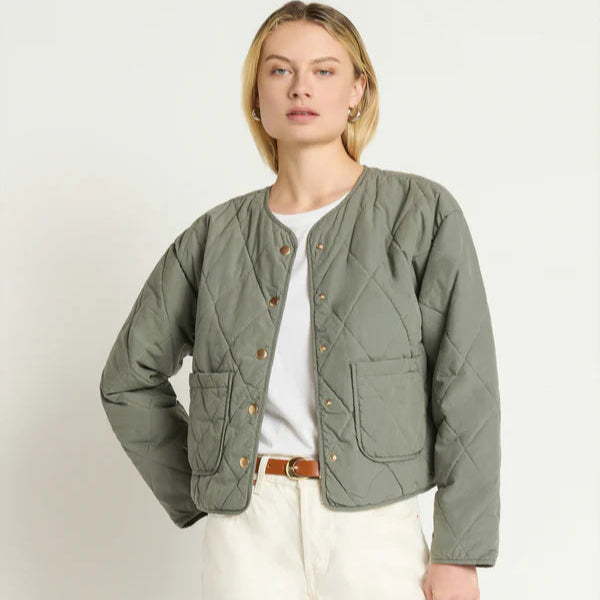A woman wearing the Aspen Quilted Jacket by Nation LTD