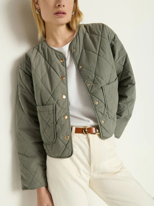 
                      
                        Woman wearing a green quilted jacket from Nation LTD
                      
                    