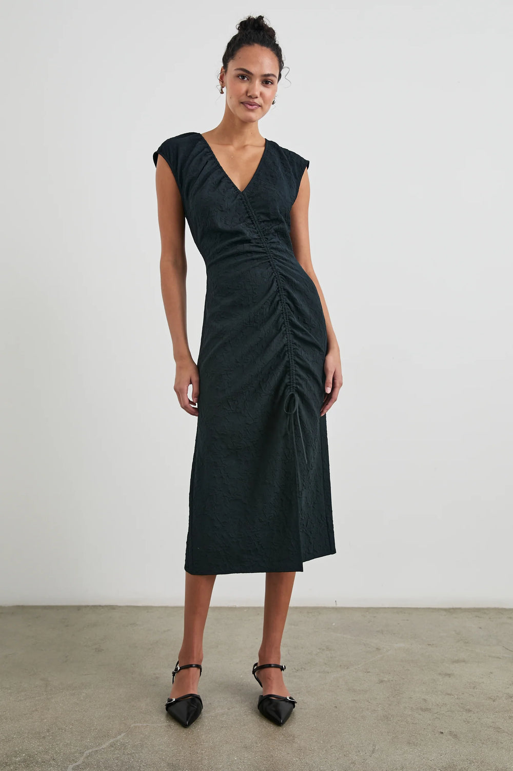 Front view of a woman wearing the Black Jacquard Auren Midi Dress by the brand Rails