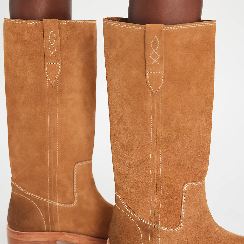 Tan knee-high suede boots from Free People