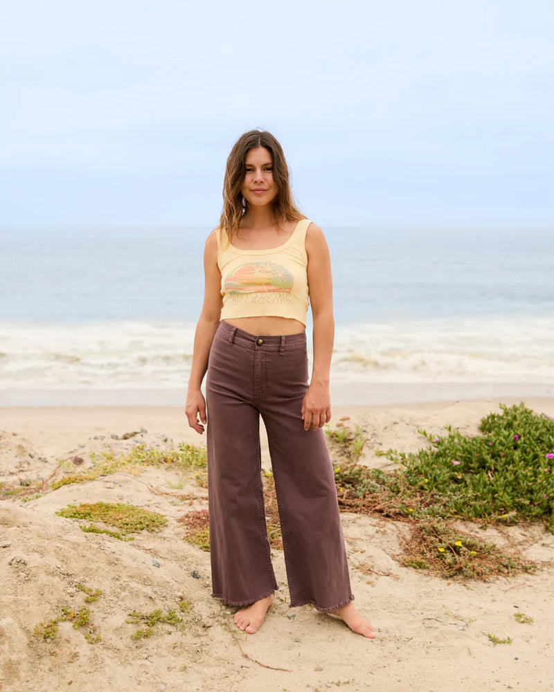 Woman at the beach wearing the Kona Free Fall Wide Leg Pants by Billabong