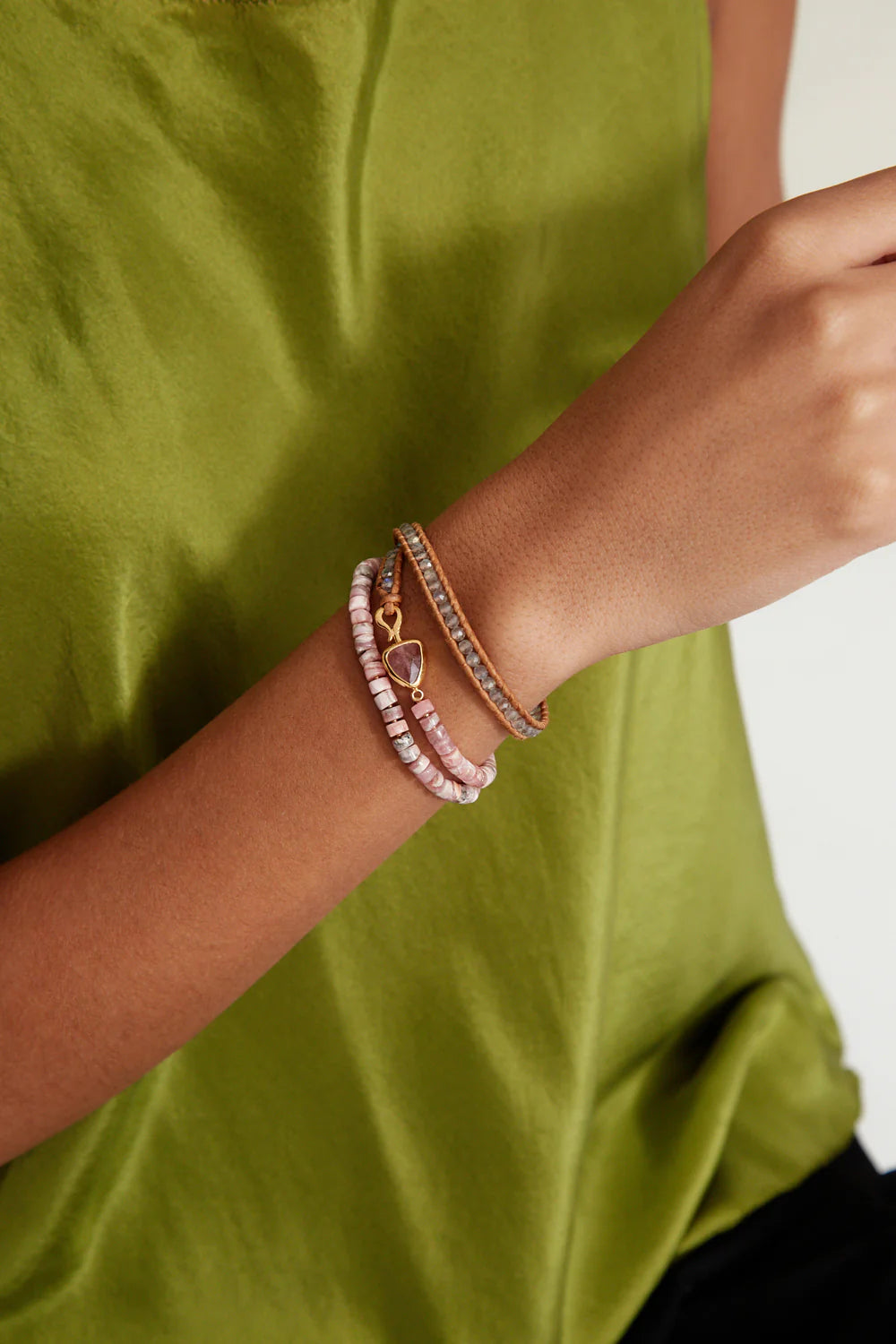 Person wearing the Pink Mix Rahel Triple Wrap Bracelet by Chan Luu