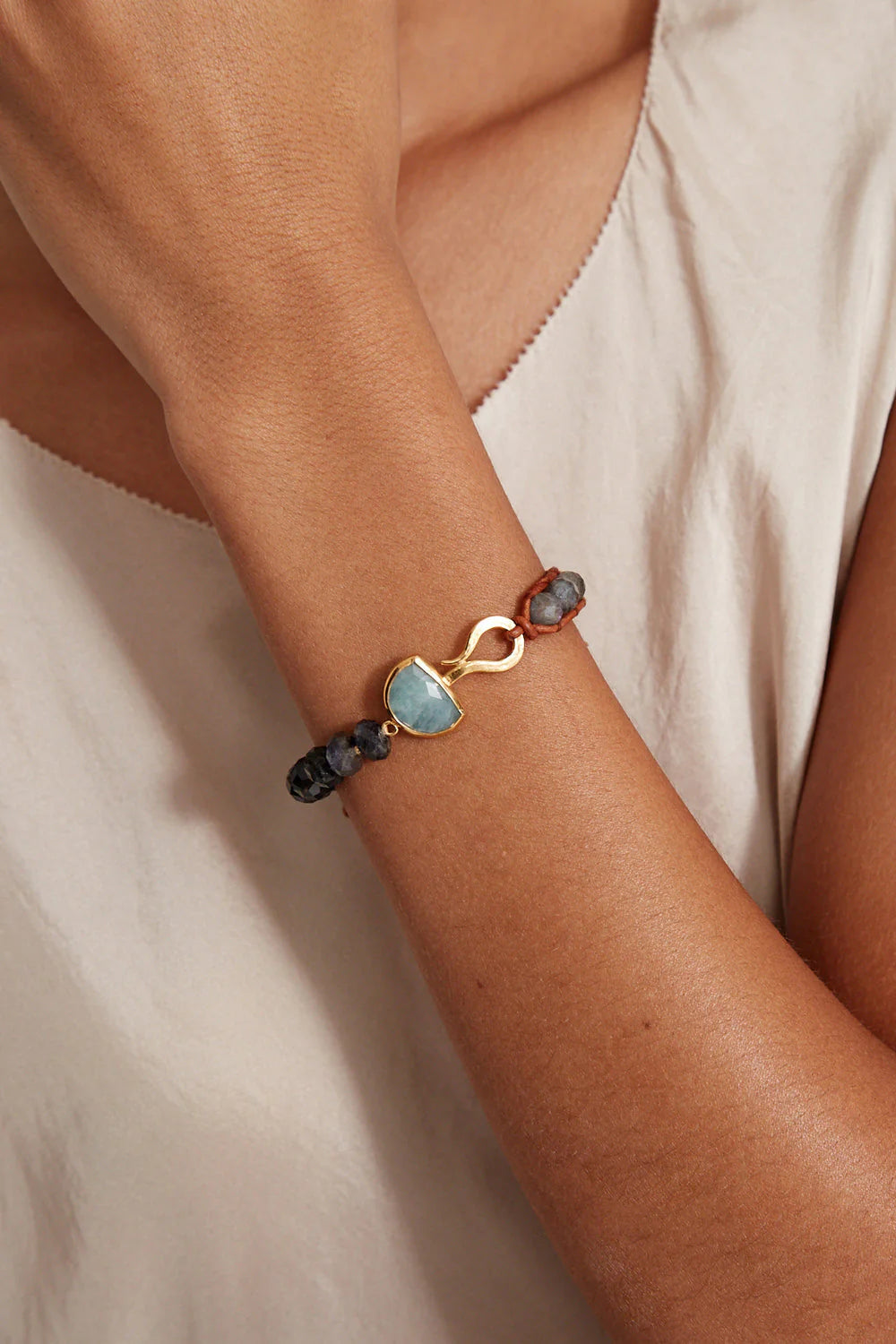 Person wearing the Iolite Mix Luna Single Wrap Bracelet by Chan Luu