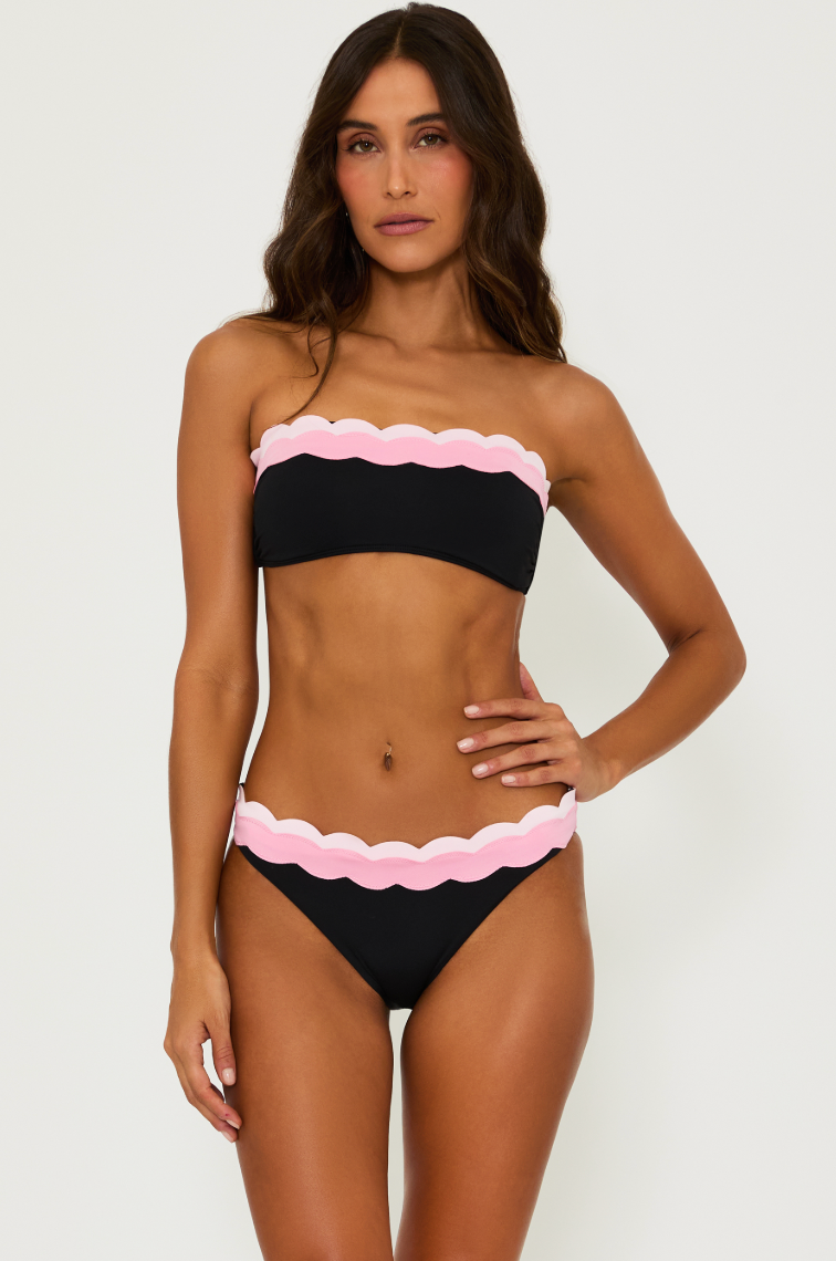 The Black and Pink Fay Bikini Bottoms by Beach Riot offer a classic swim silhouette with cheeky coverage and colorblock detail. 