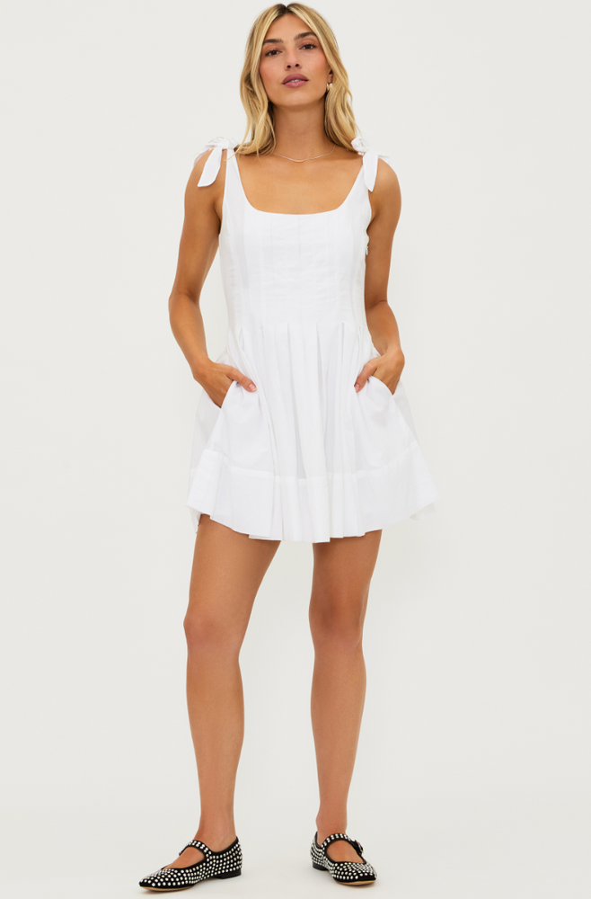 
                      
                        Women's sleeveless, white cotton mini dress with pockets
                      
                    