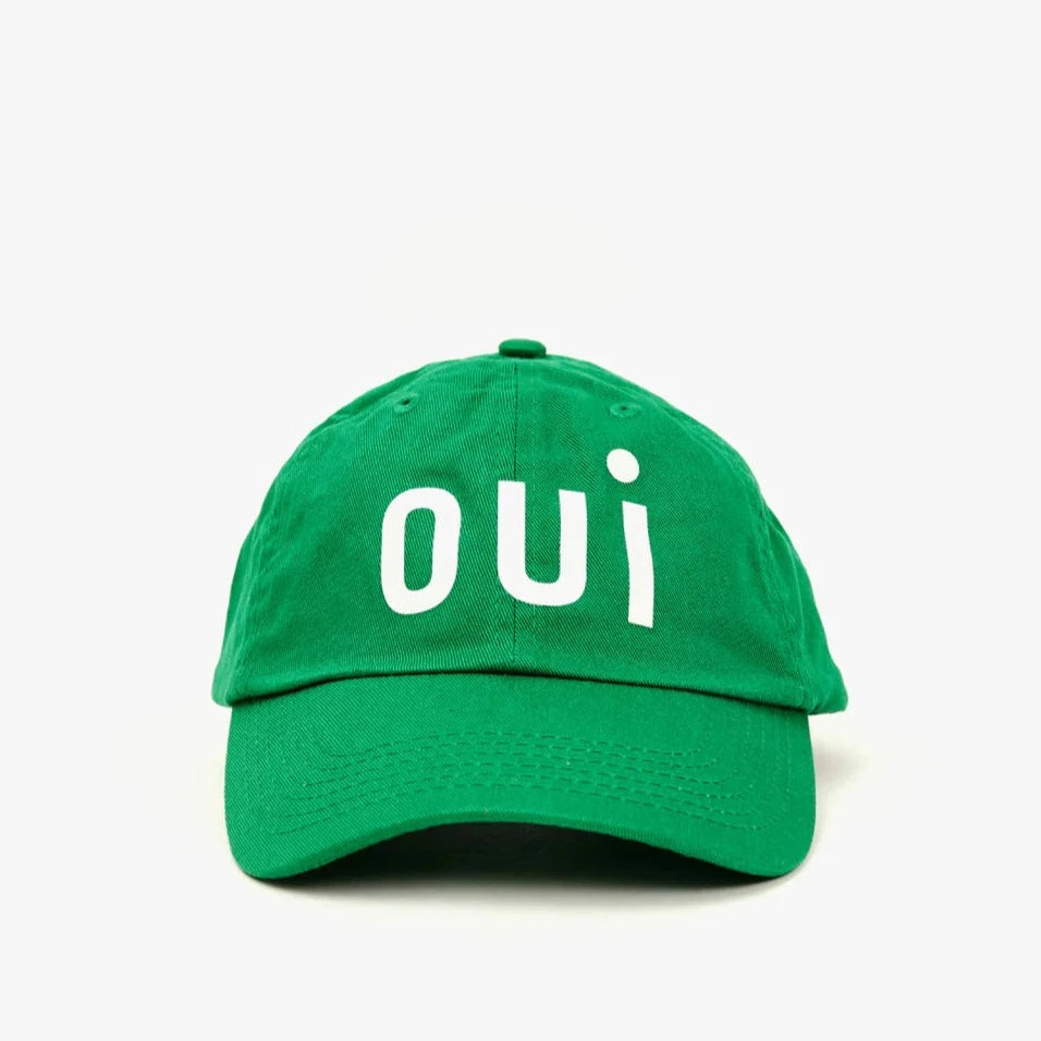 a green baseball hat with the word 