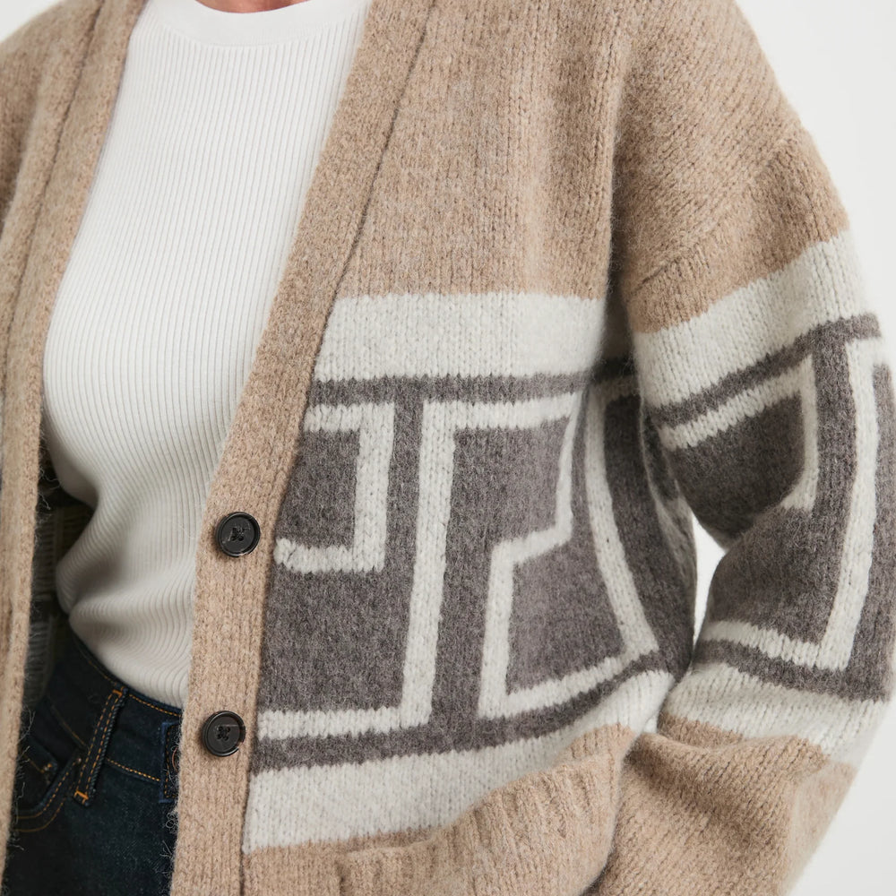 This luxe cardigan from Rails offers a cozy wool blend with geometric motifs, patch pockets, and ribbed hems.