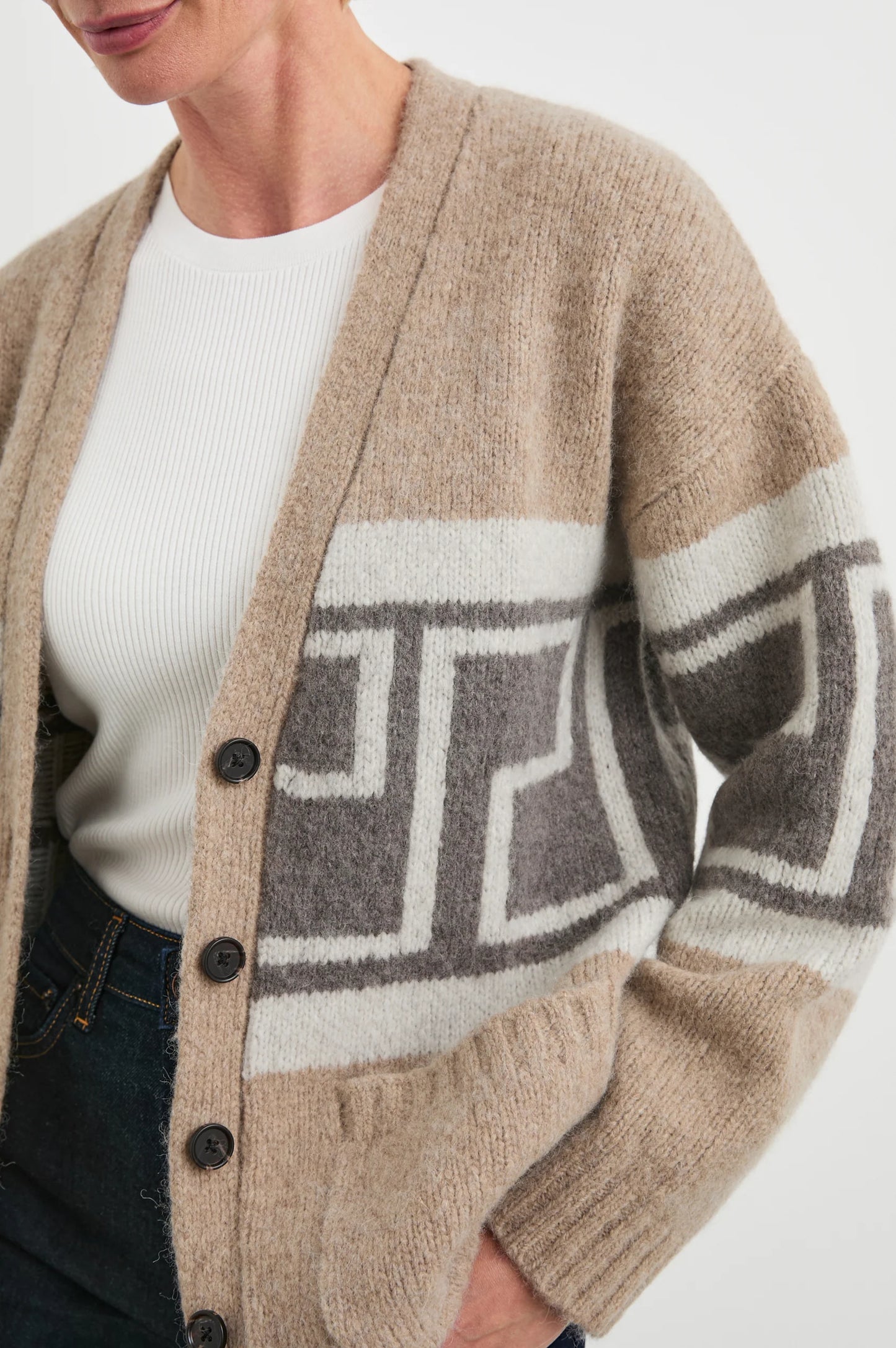 This luxe cardigan from Rails offers a cozy wool blend with geometric motifs, patch pockets, and ribbed hems.