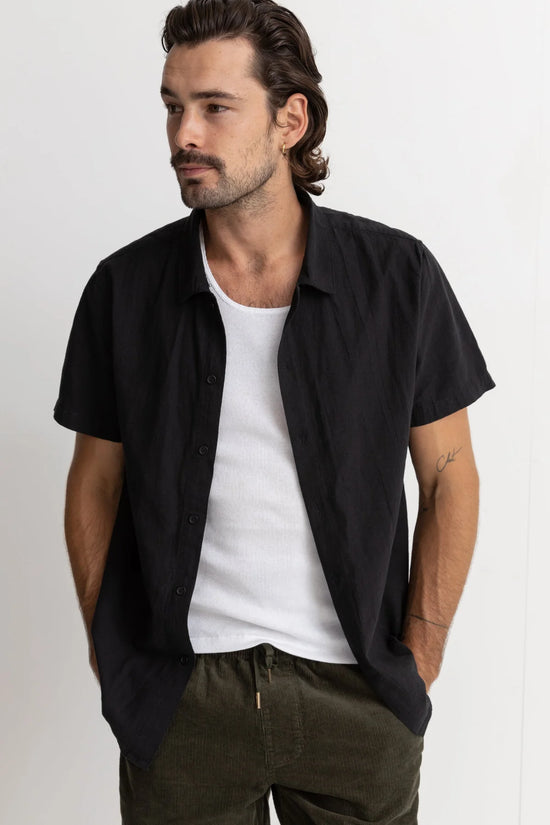 Front, unbuttoned view of the Classic Lienen Short Sleeve shirt in black by Rhythm