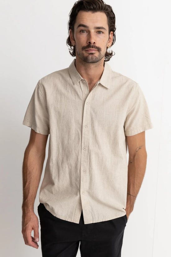 Front, buttoned up view of the men's Classic Linen Short Sleeve Shirt by Rhythm in color Sand