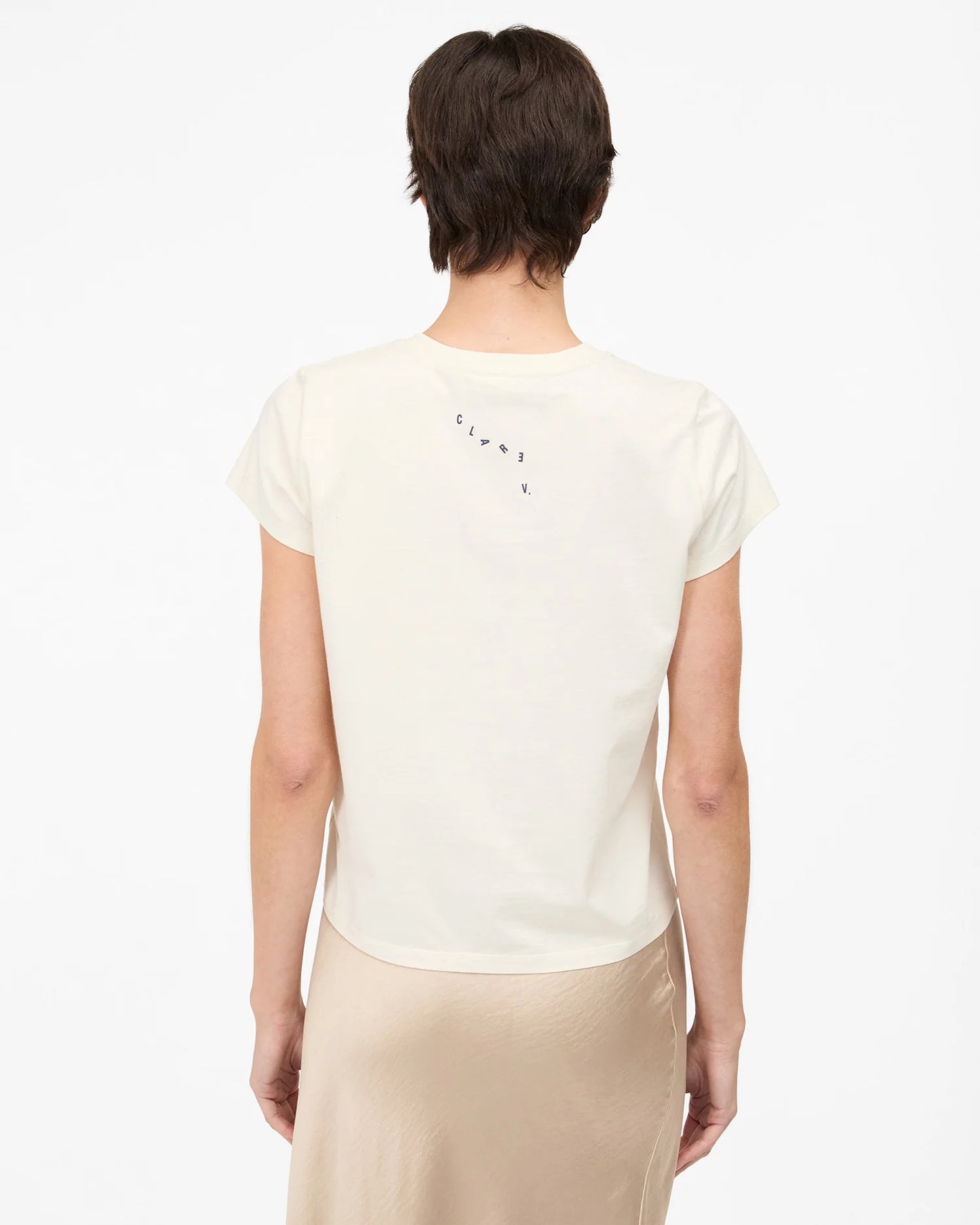 Person wearing a white t-shirt by Clare V. 