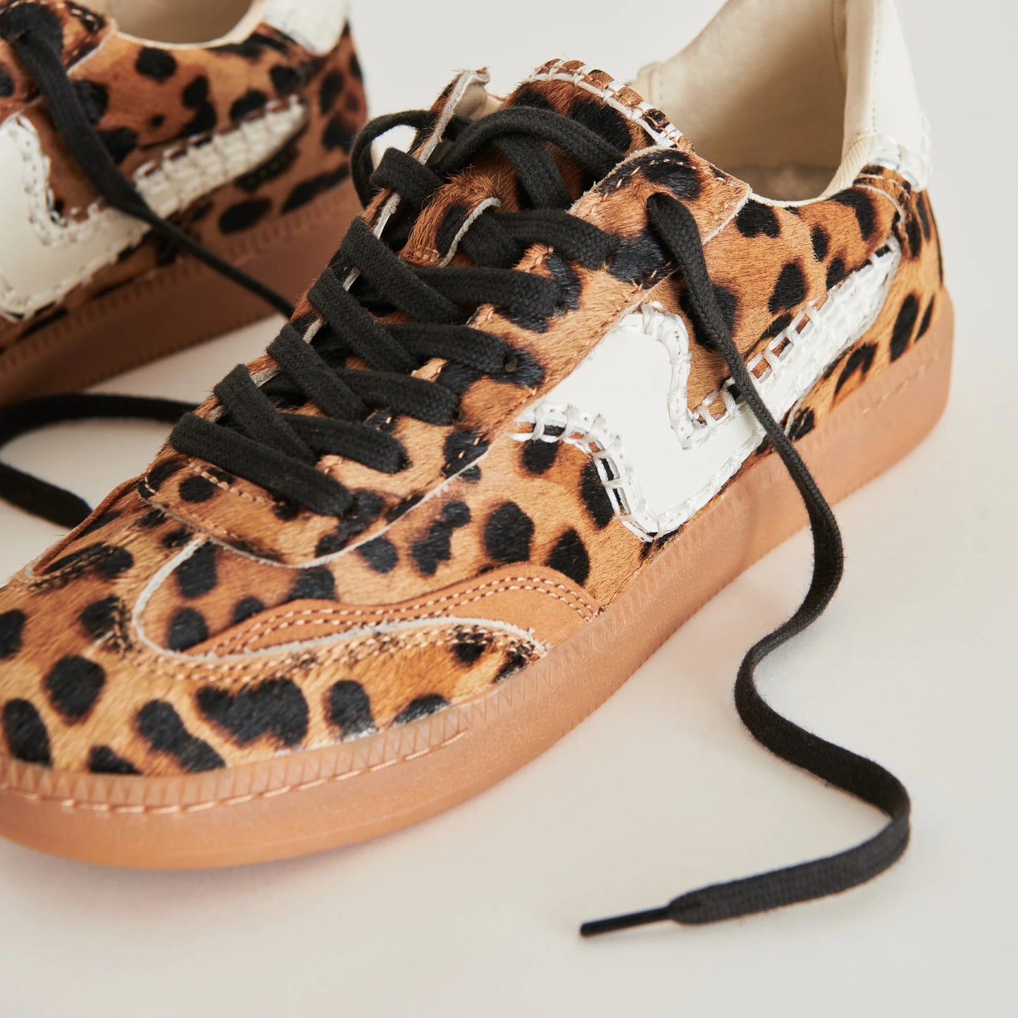 Design detail on the Notice Stitch Sneakers in Dark Leopard Calf Hair by the brand Dolce Vita