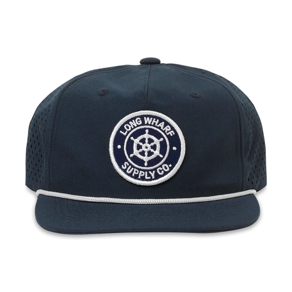The Long Wharf Supply Ensign Performance Patch Hat in Navy is at Harbour Thread in St. Pete, FL. 