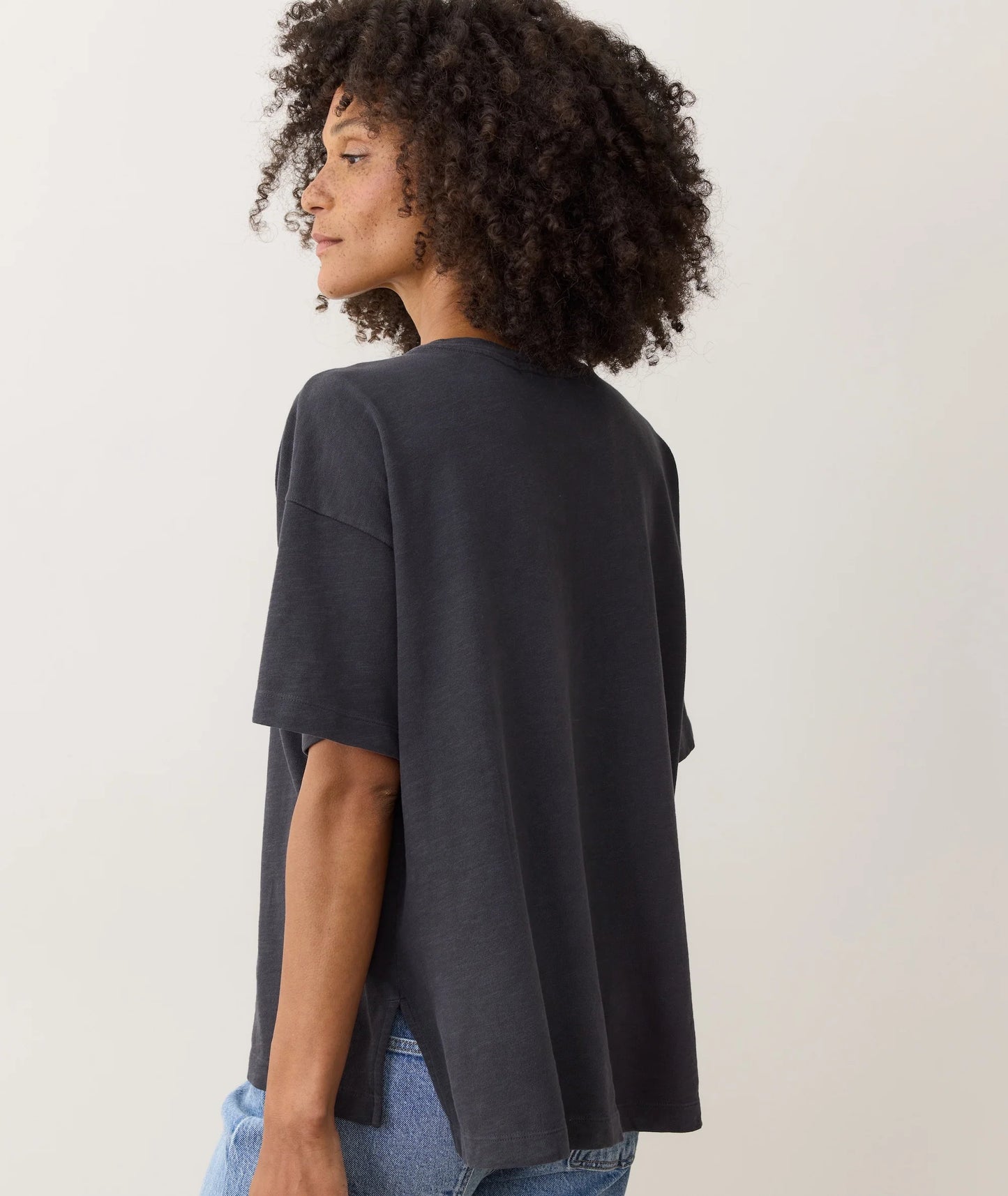 Woman wearing a black oversized t-shirt from Marine Layer