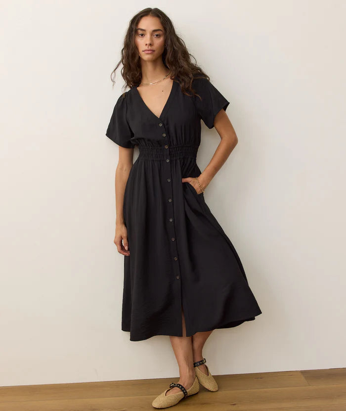 The Annika MIdi Dress features slight flutter sleeves and a smocked waist for a flattering fit. Get yours today at Harbour Thread boutique in Burlington, VT!