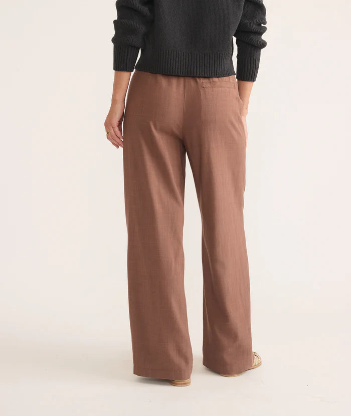 
                      
                        Back view of the Allison Trousers by Marine Layer in the color Pinecone, which is a light brown color. 
                      
                    