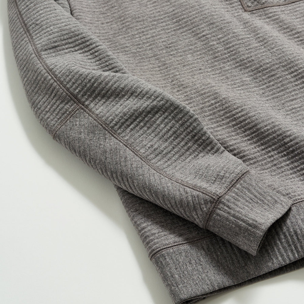 
                      
                        Close up of sleeves on a men's grey pullover
                      
                    