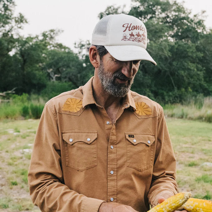 
                      
                        A man wearing the Howler Posse Foam Dome Hat by Howler Bros
                      
                    