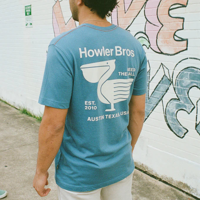 Back view of the Blue Blended Pelican Postage Pocket T-Shirt by Howler Bros