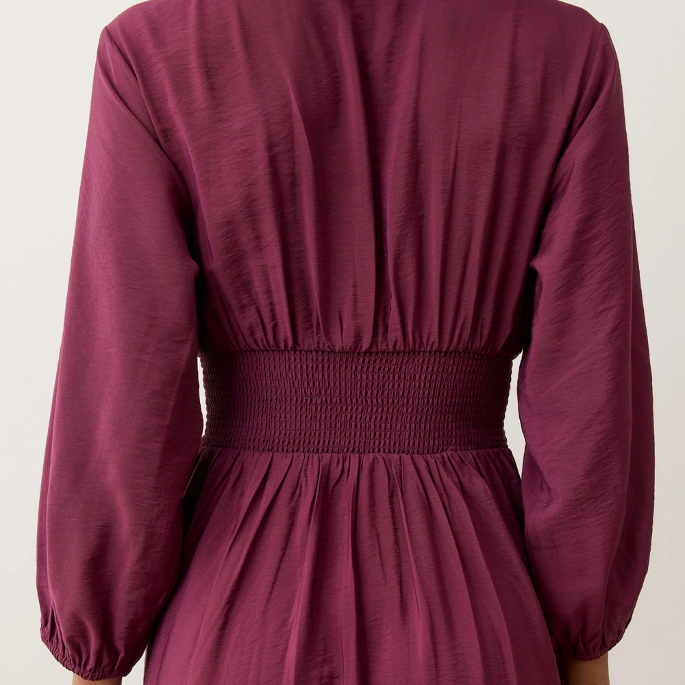 
                      
                        Smocked dress in the color Fig
                      
                    