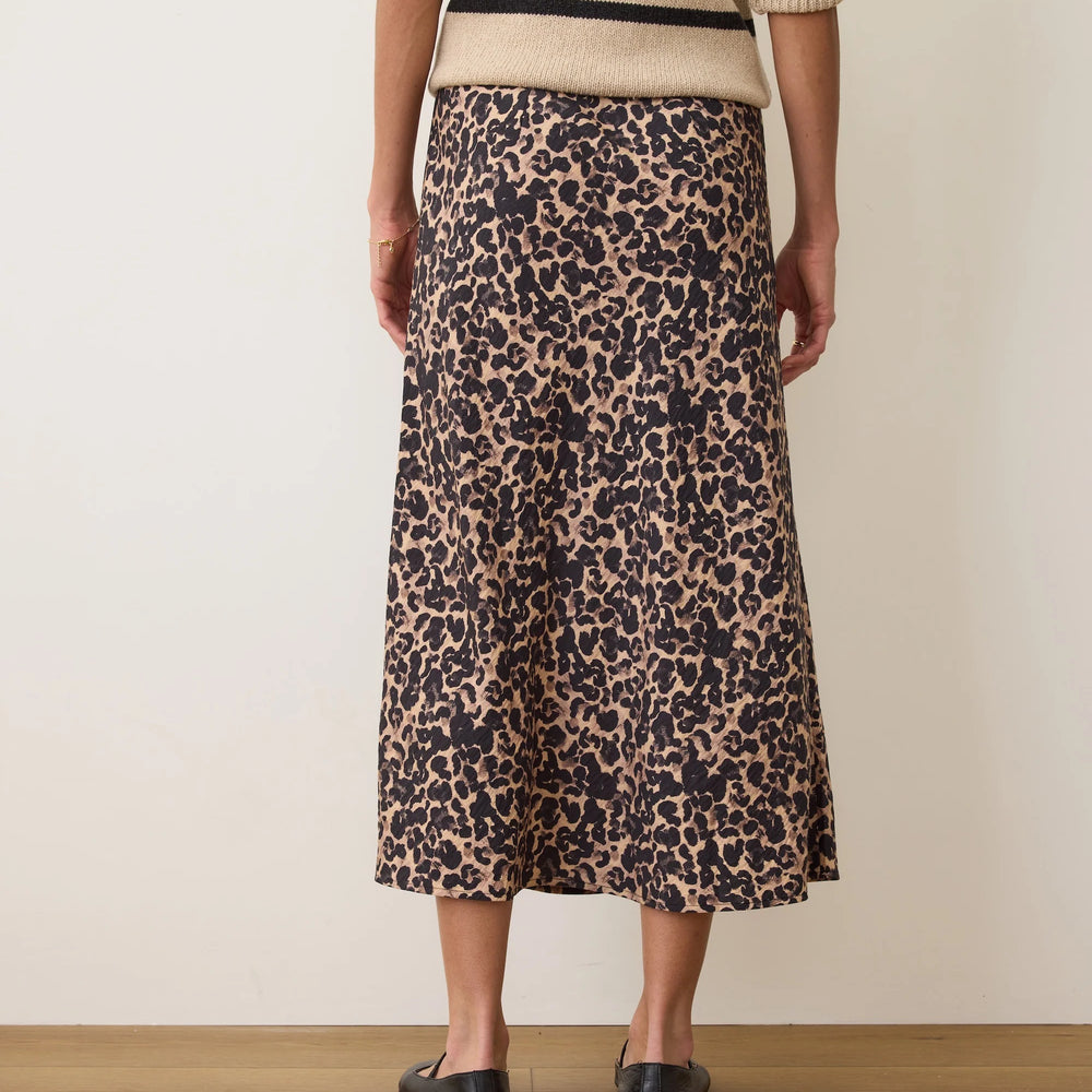 
                      
                        Person wearing a leopard print skirt and oversized sweater from Marine Layer
                      
                    