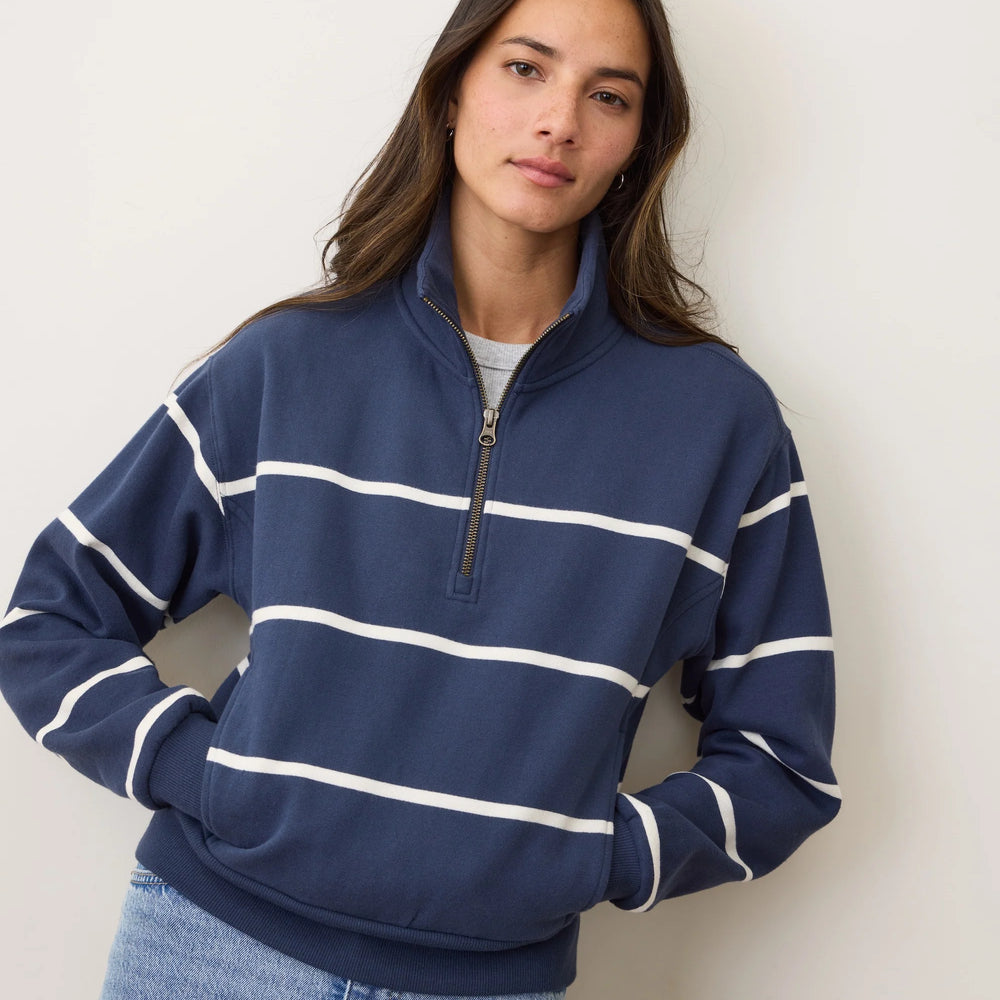 A woman wearing the Marine Layer Cloud 9 Fleece Half Zip