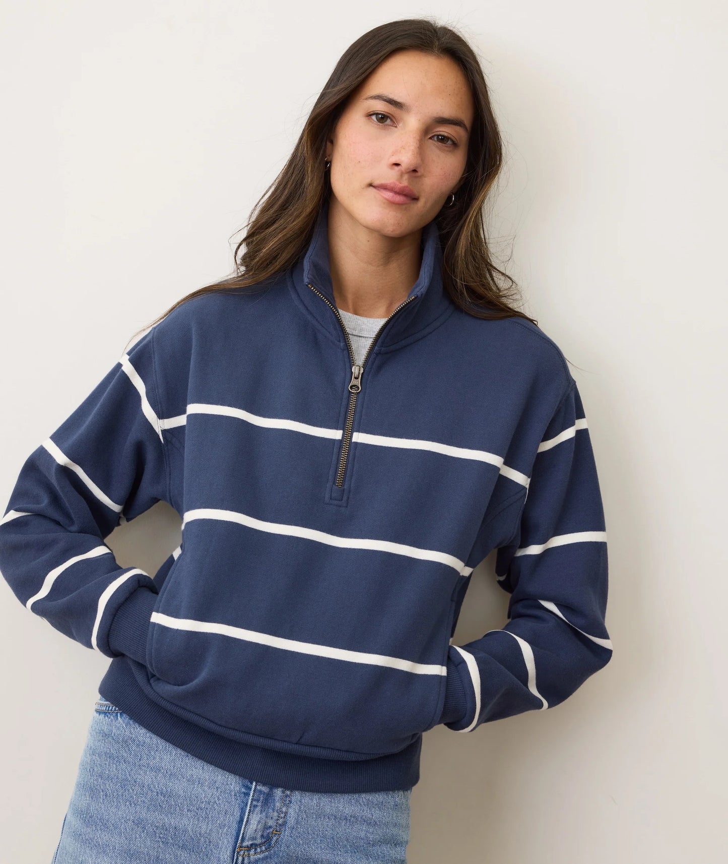 A woman wearing the Marine Layer Cloud 9 Fleece Half Zip