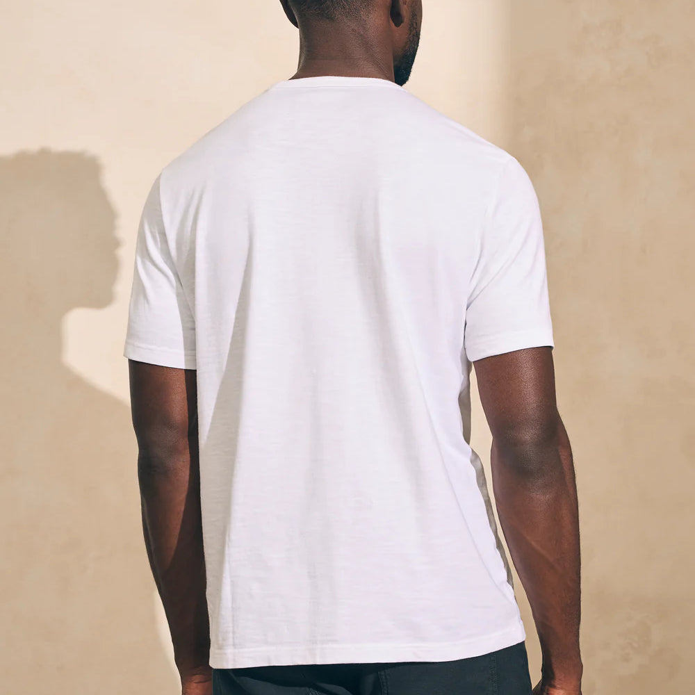 Back view of man wearing a white short sleeve t-shirt by Faherty