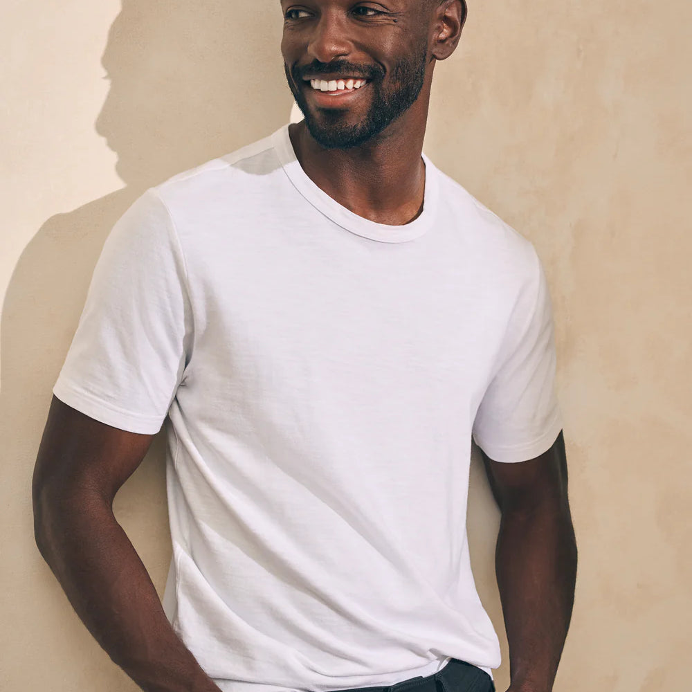 Front view of man wearing a white short sleeve t-shirt by Faherty