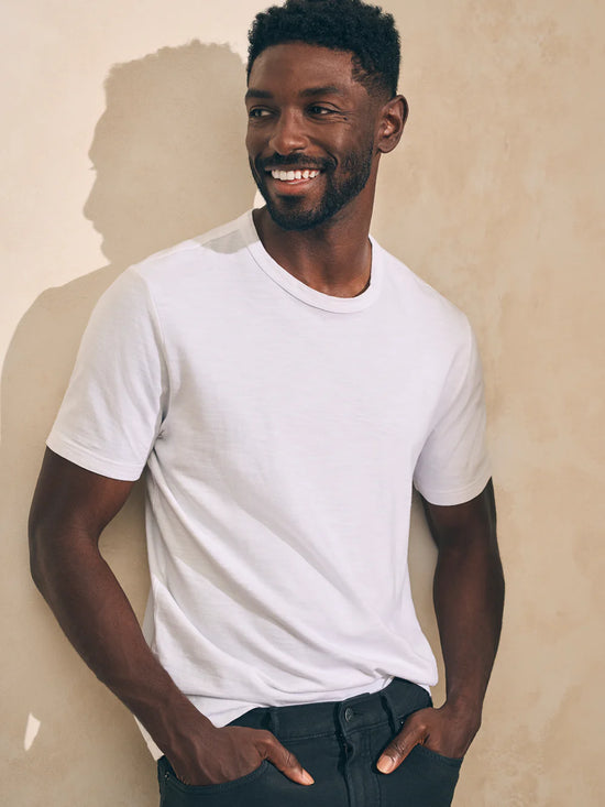 Front view of man wearing a white short sleeve t-shirt by Faherty