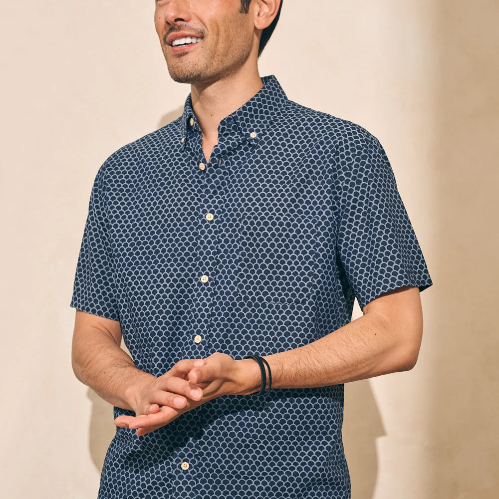 
                      
                        Front view of a man wearing a fishscale print short sleeve button up shirt by Faherty
                      
                    