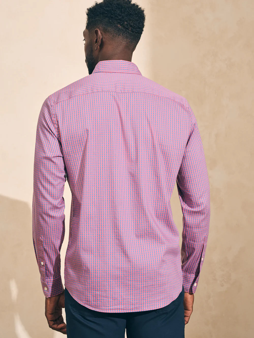 Back view of a man wearing the The Movement Shirt by Faherty in color Blue Rose Gingham