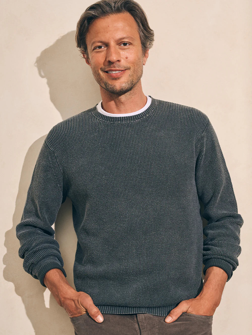 The Faded Black Sunwashed Crewneck Sweater by Faherty