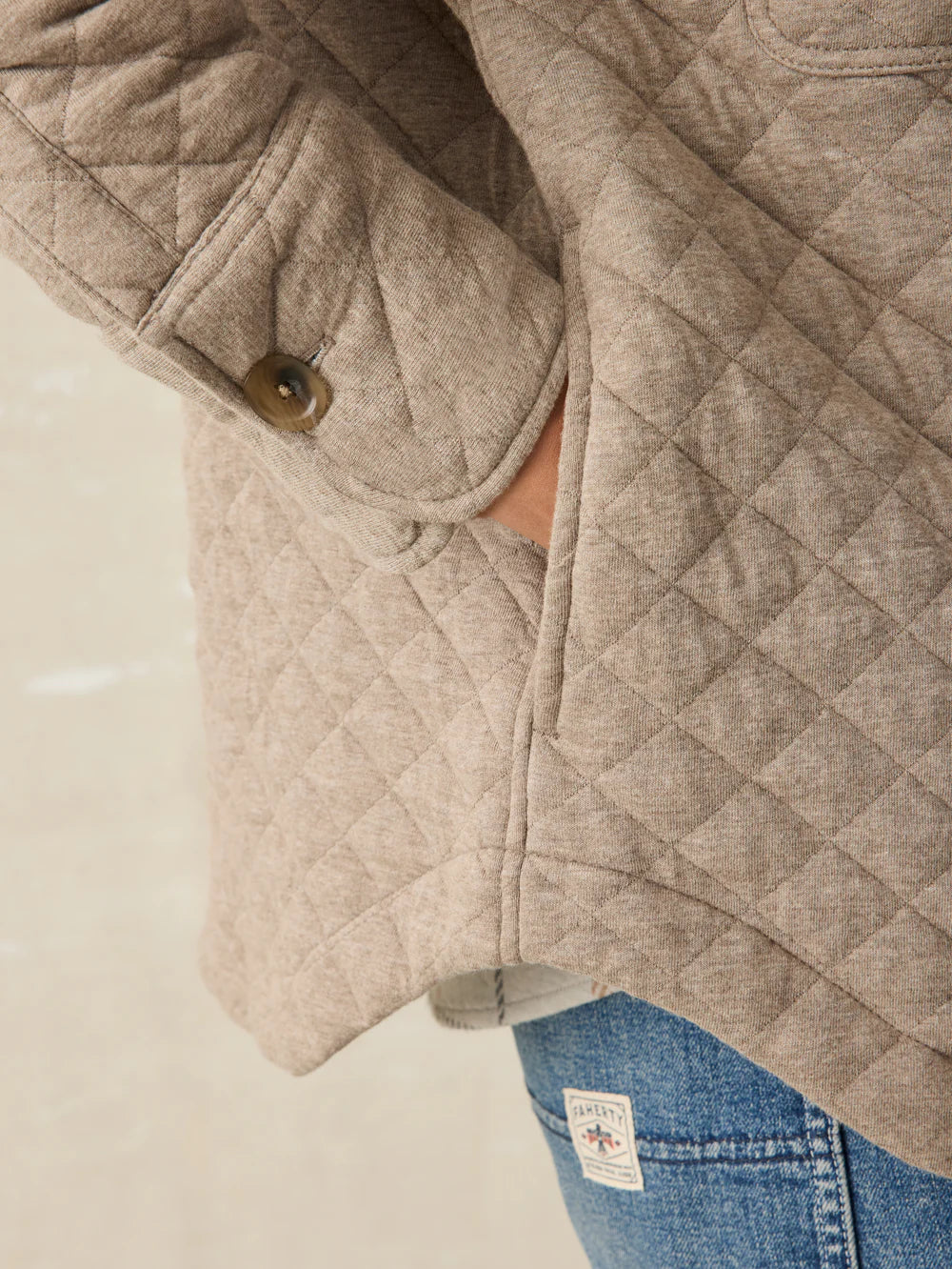 Pocket and sleeve cuff design details on the women's Epic Quilted Fleece Shirt Jacket by Faherty