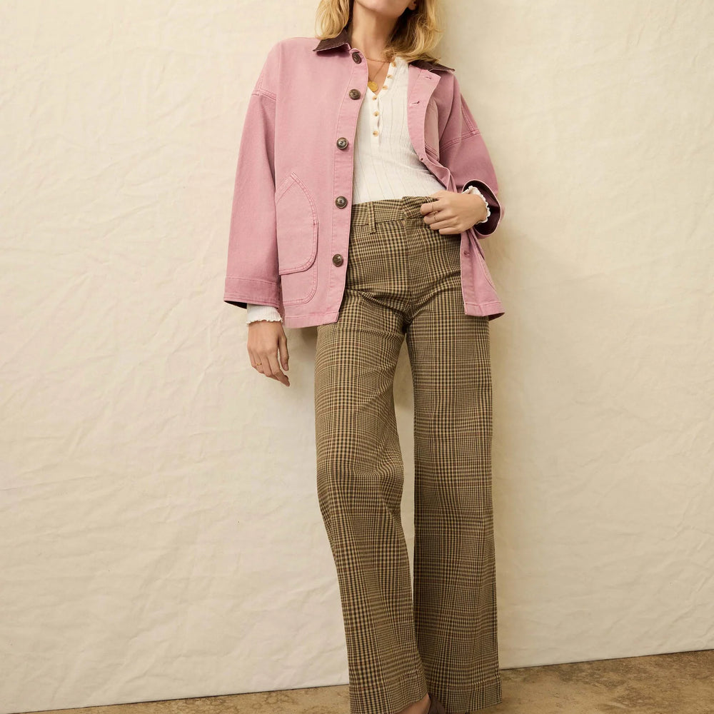 
                      
                        Woman wearing a pink blazer, white shirt, and plaid pants from Faherty
                      
                    