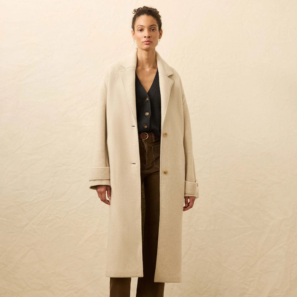 A woman wearing the Faherty Atlantic Knit Coat in the color