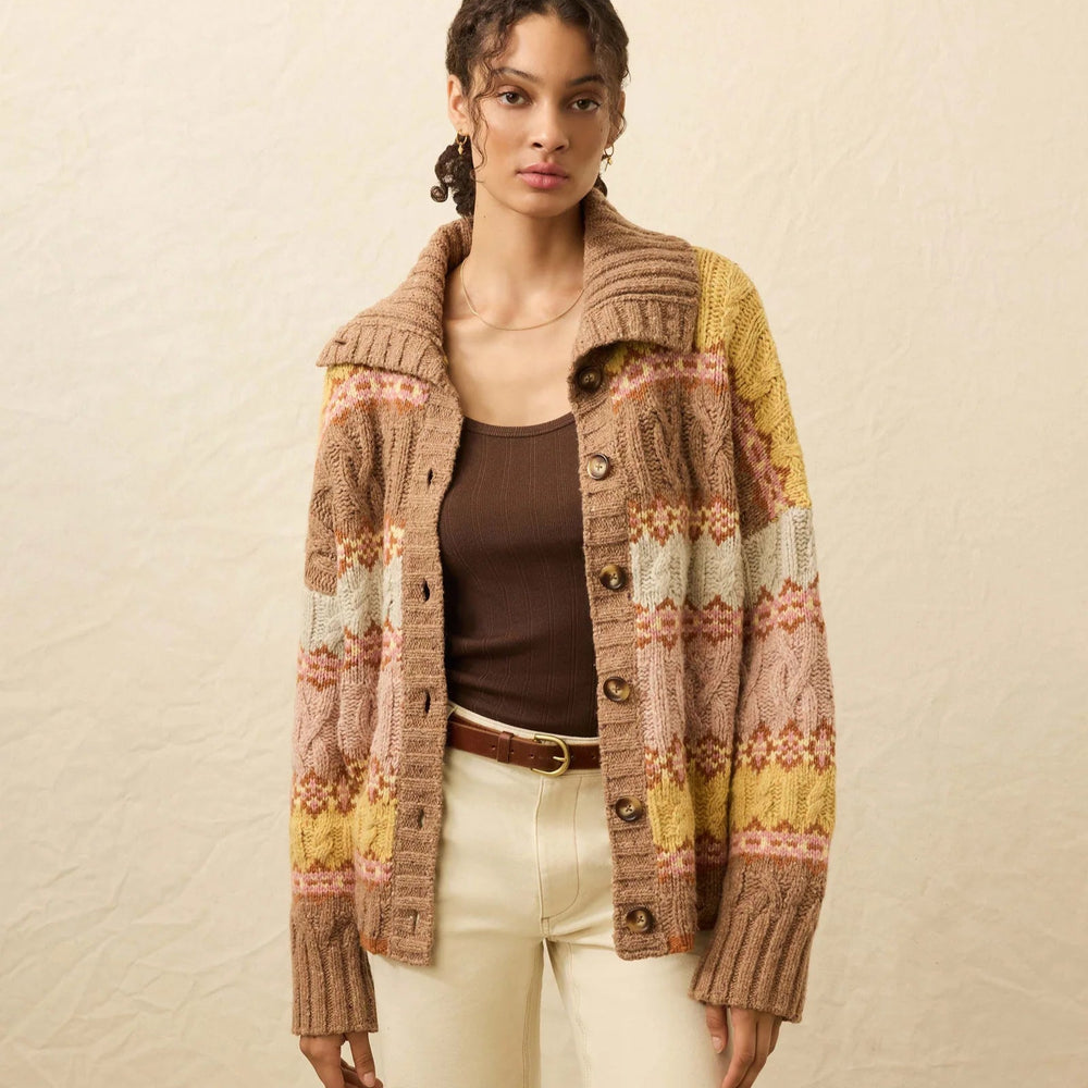 A woman wearing the Faherty Highland Fairisle Cardigan in the color Lakeside Fairisle Haze