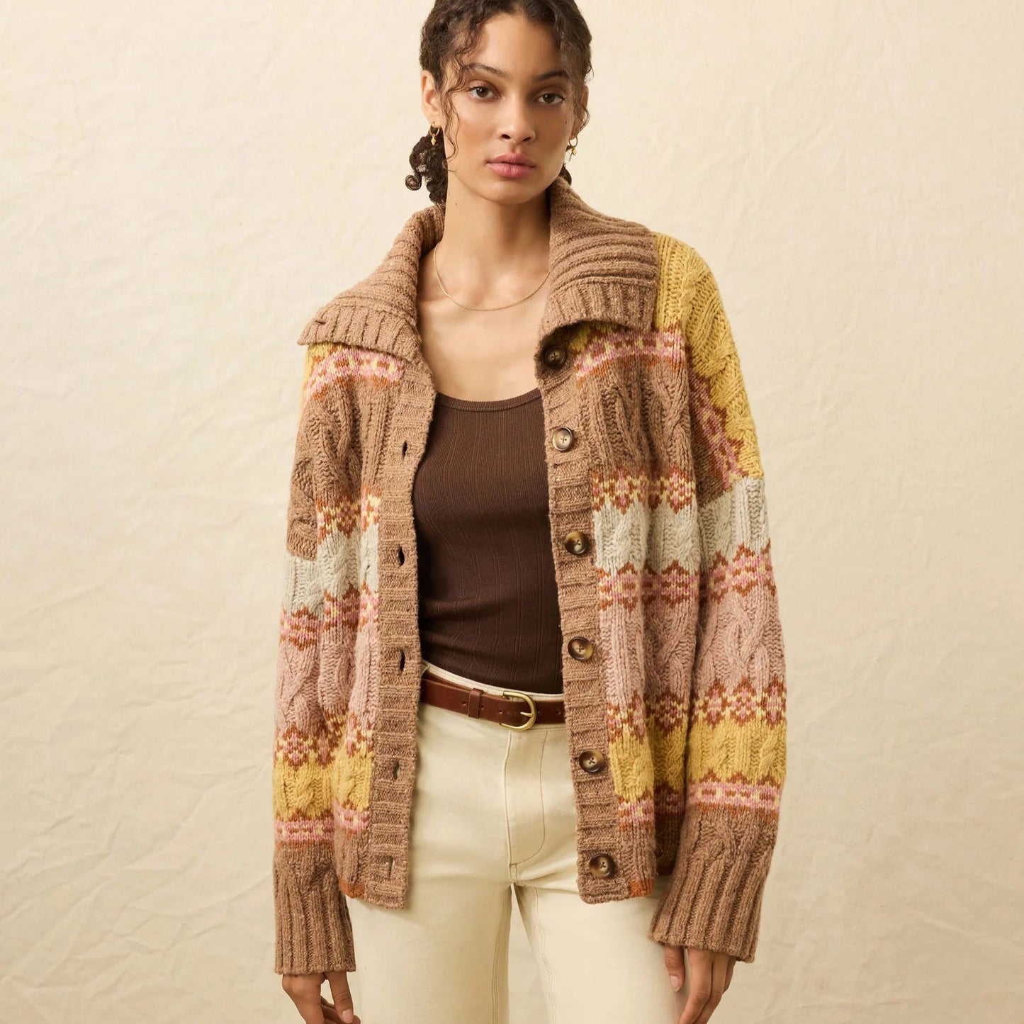 A woman wearing the Faherty Highland Fairisle Cardigan in the color Lakeside Fairisle Haze
