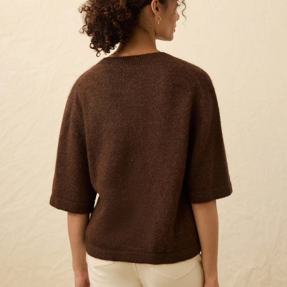 
                      
                        Woman wearing a brown sweater with elbow length sleeves from Faherty
                      
                    