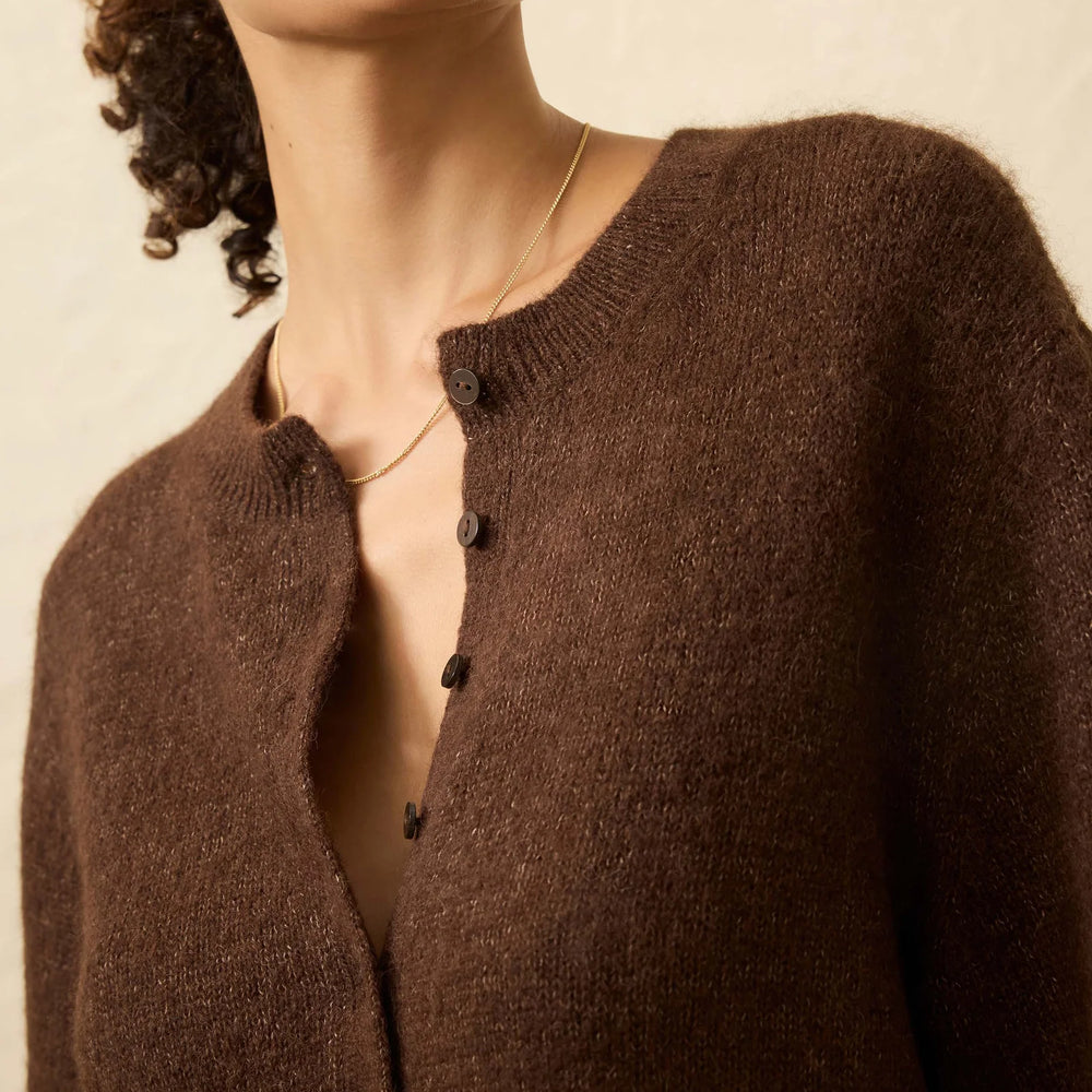 Woman wearing a brown cardigan