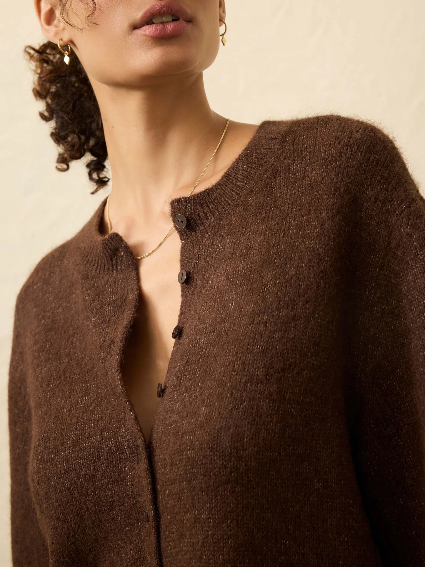 Woman wearing a brown cardigan