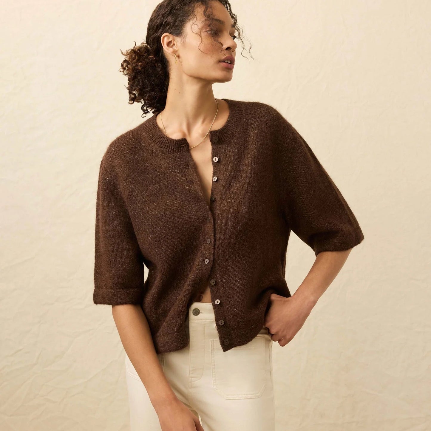 A woman wearing the Faherty Apres Alpaca Cardigan in the color Walnut Brown