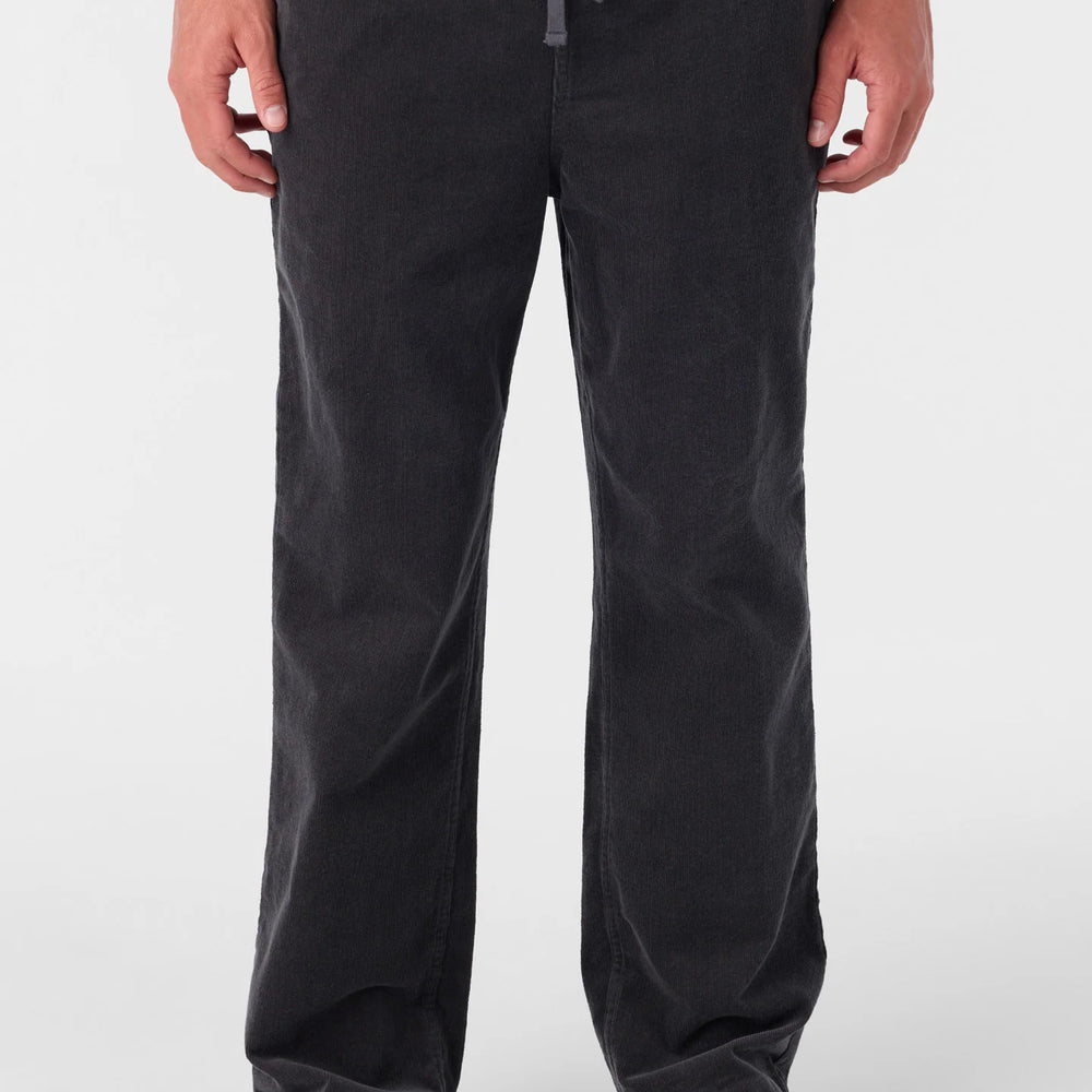 A man wearing the O'Neill Eco Slider Pants in the color Graphite