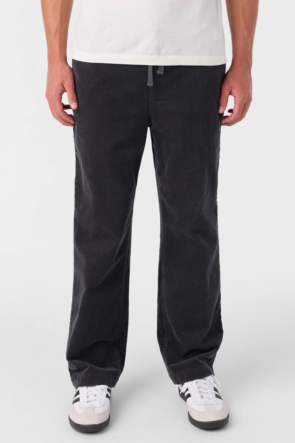 A man wearing the O'Neill Eco Slider Pants in the color Graphite