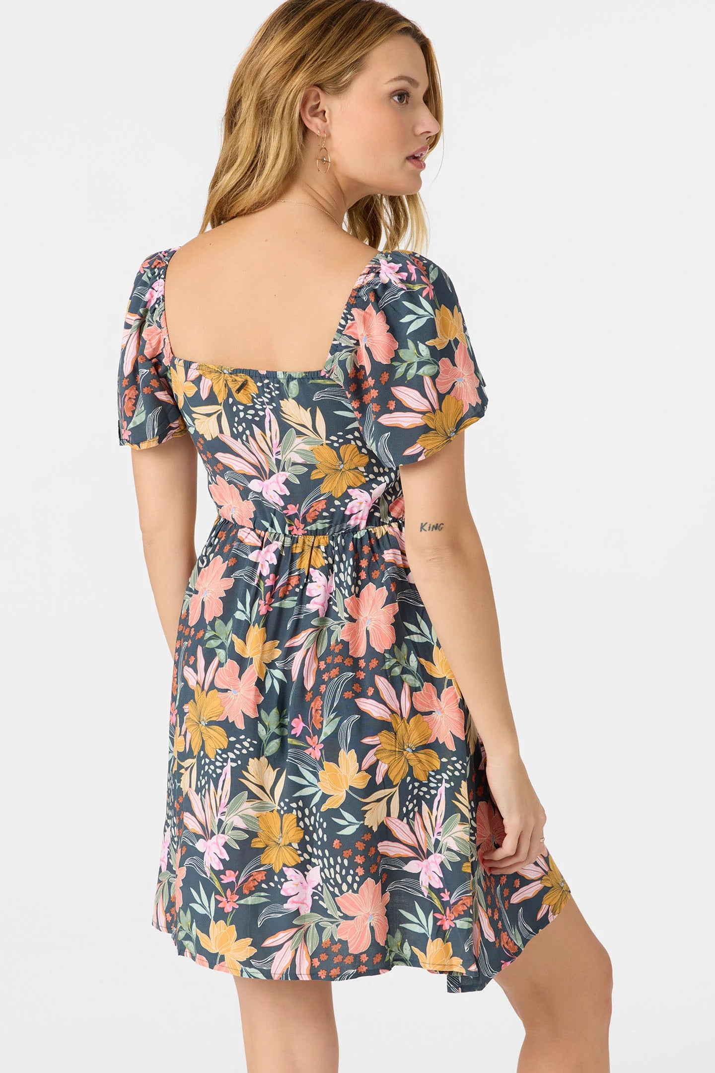 Woman wearing the Carina Floral Mini Dress by O'Neill