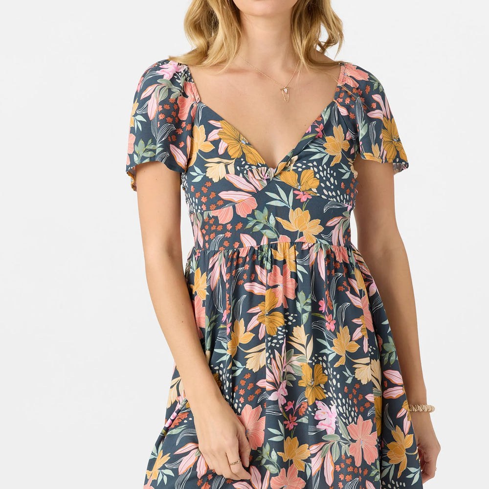 
                      
                        Woman wearing a floral dress on a white background
                      
                    