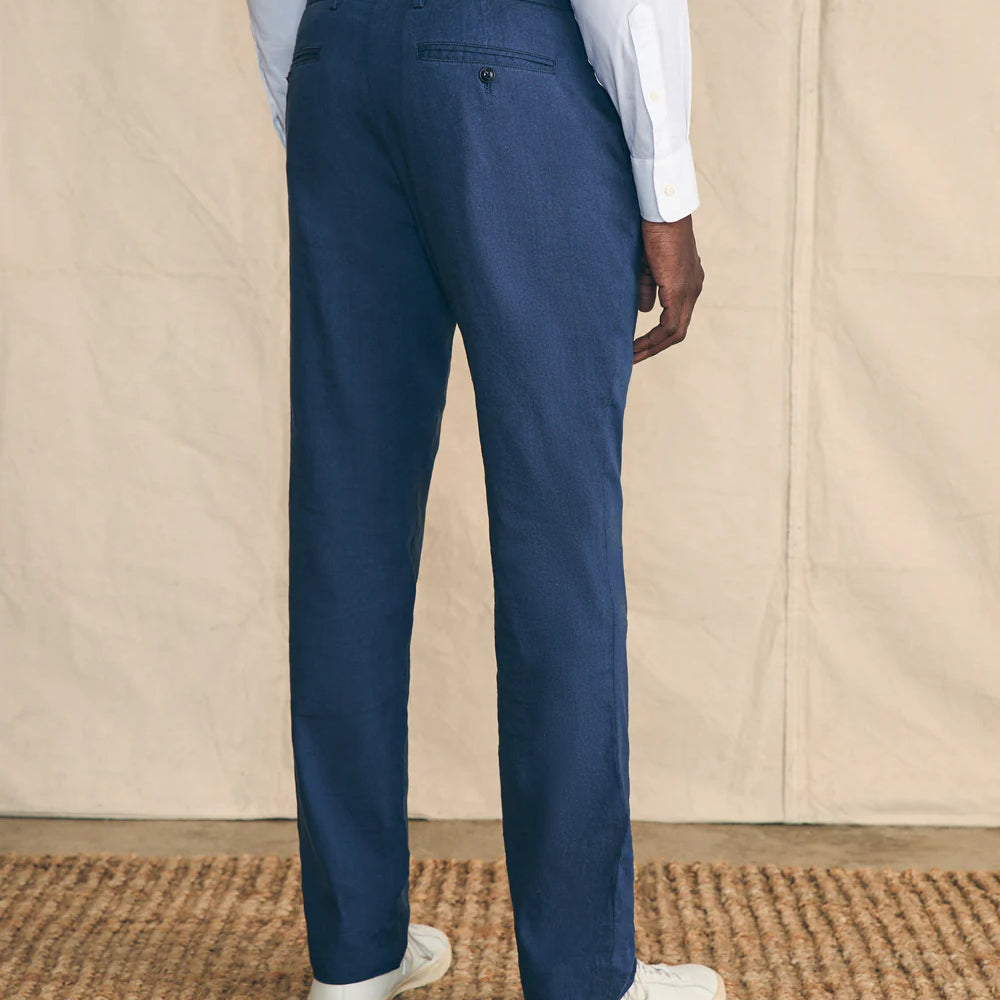 
                      
                        Back view of the Navy Movement Flex Linen Trousers by Faherty
                      
                    