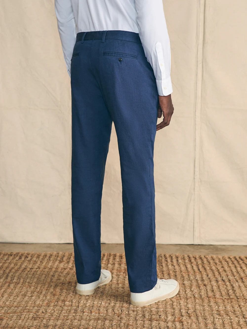 Back view of the Navy Movement Flex Linen Trousers by Faherty